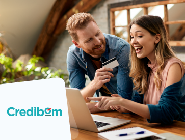 couple with a credit card and computer