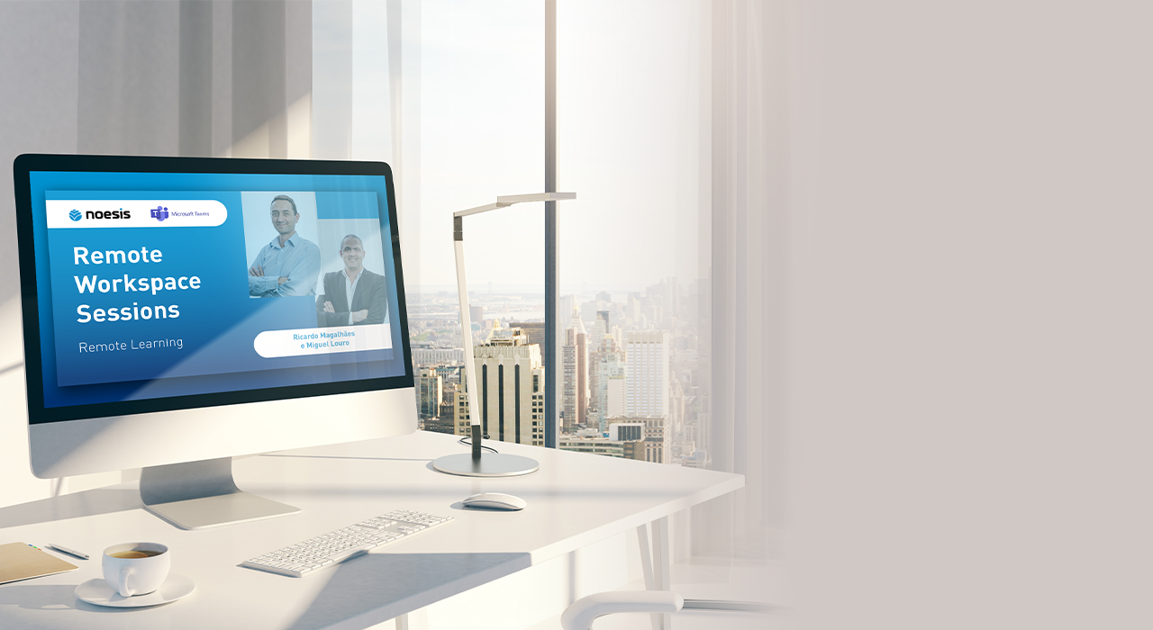 Secretária com computador com imagem das remote workspace sessions da noesis